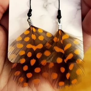 Orange & black feather drop handmade earrings. $Firm.